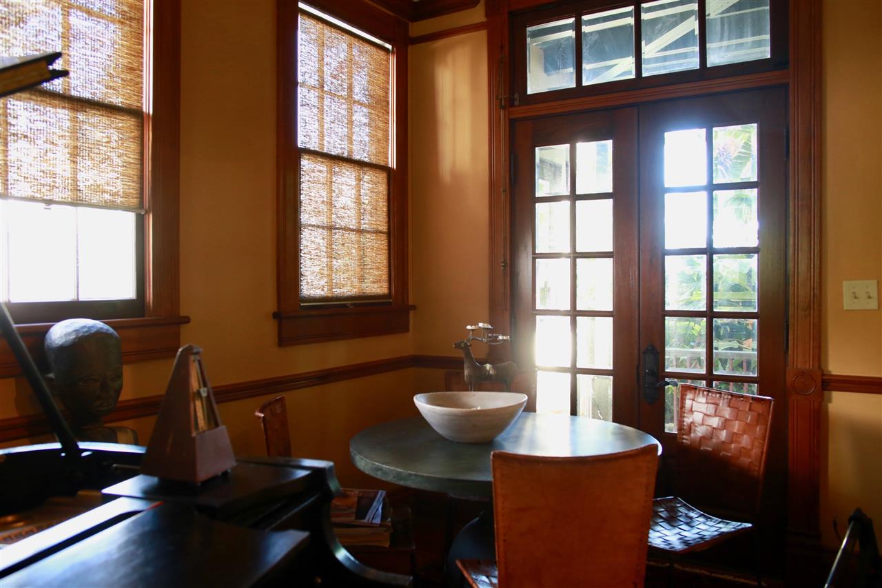 15 Bridge Street St. Augustine, FL 32084 - Photo 14 of 49 a view of a dining room with furniture a chandelier and wooden floor