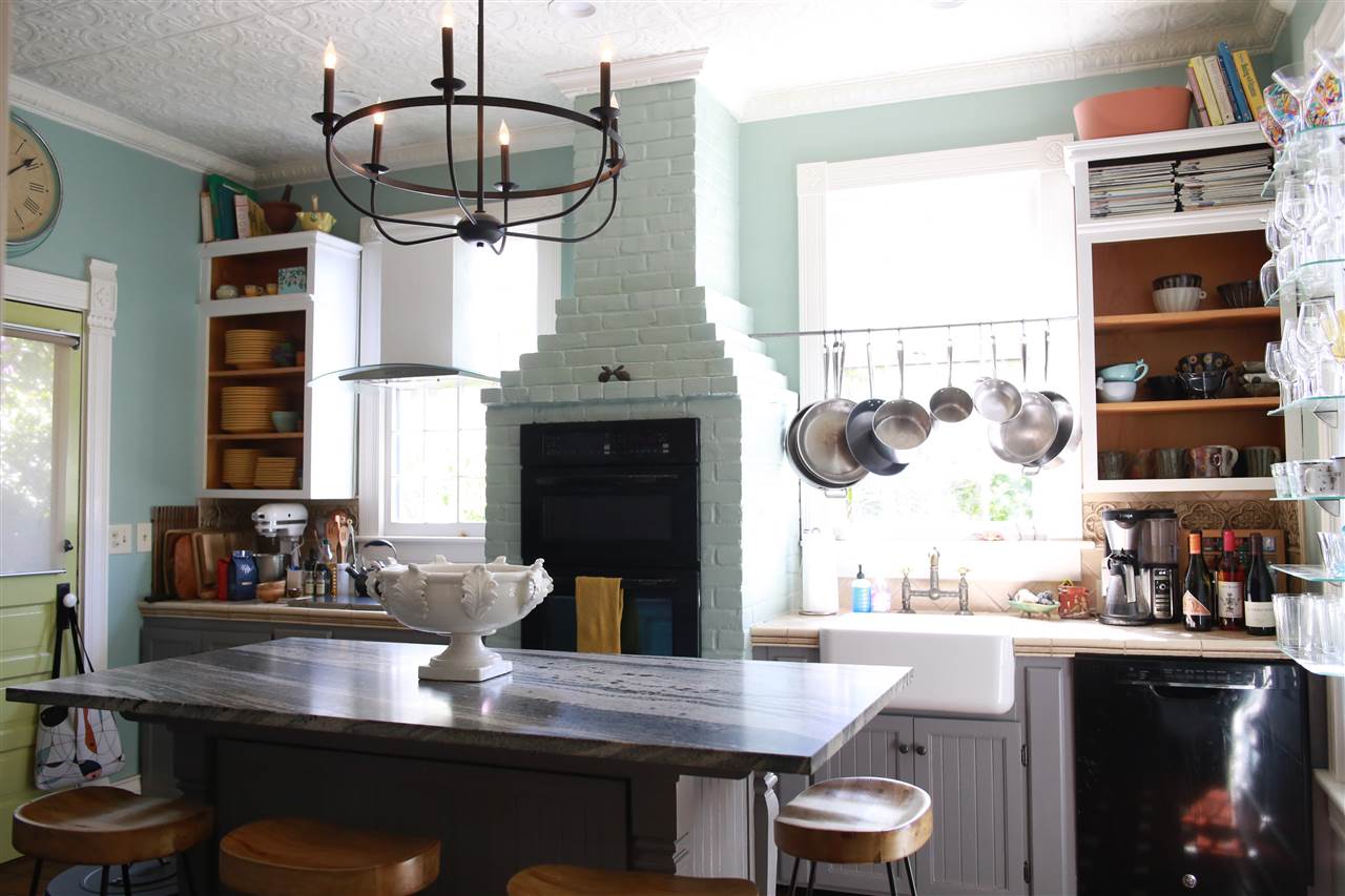15 Bridge Street St. Augustine, FL 32084 - Photo 17 of 49 a kitchen with a table chairs and window