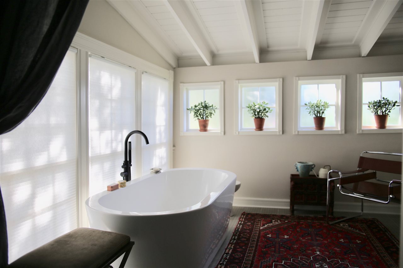 15 Bridge Street St. Augustine, FL 32084 - Photo 26 of 49 a bathroom with a sink and a mirror