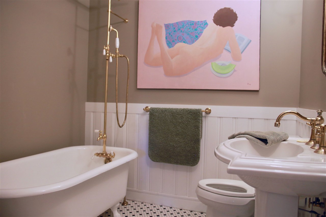 15 Bridge Street St. Augustine, FL 32084 - Photo 30 of 49 a bathroom with a toilet sink and mirror