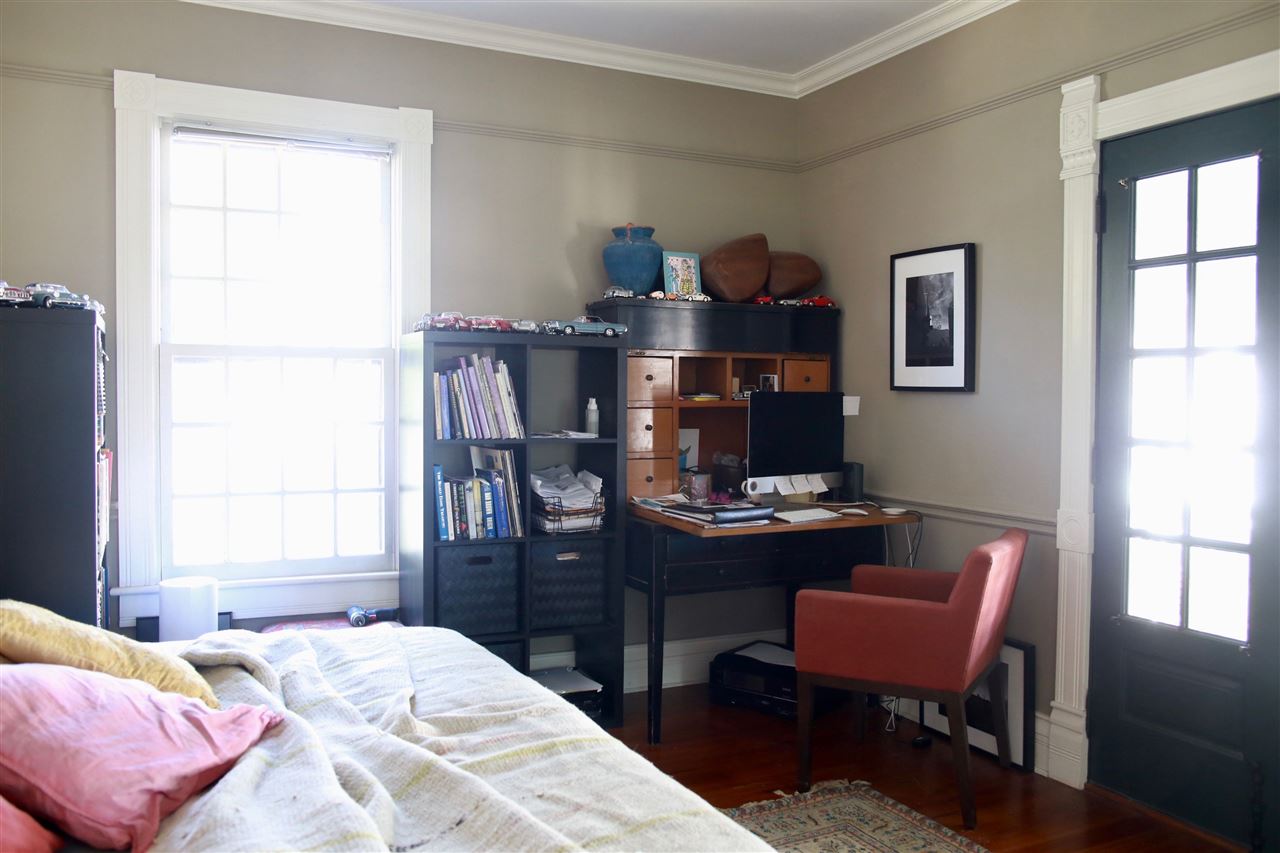 15 Bridge Street St. Augustine, FL 32084 - Photo 32 of 49 a bedroom with a bed and a desk in it