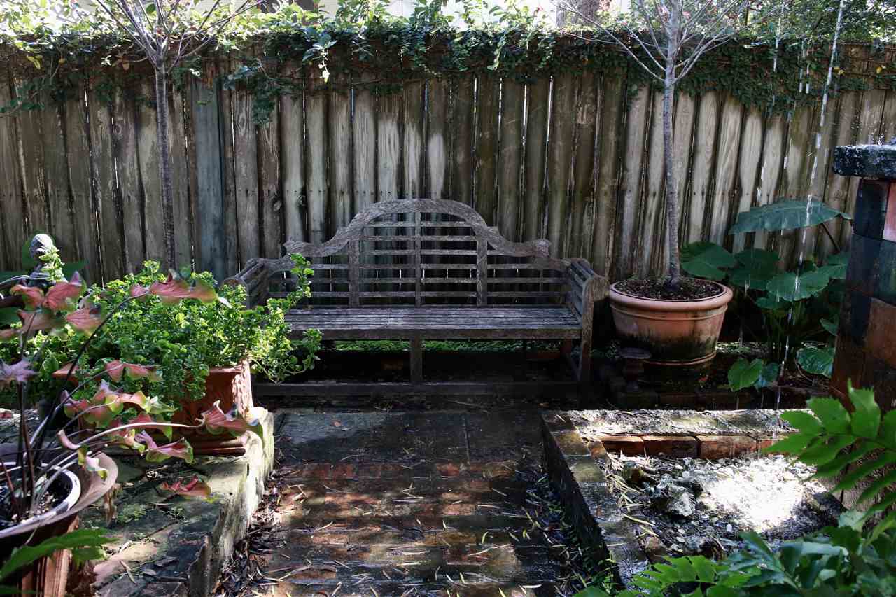 15 Bridge Street St. Augustine, FL 32084 - Photo 46 of 49 a garden filled with lots of potted plants