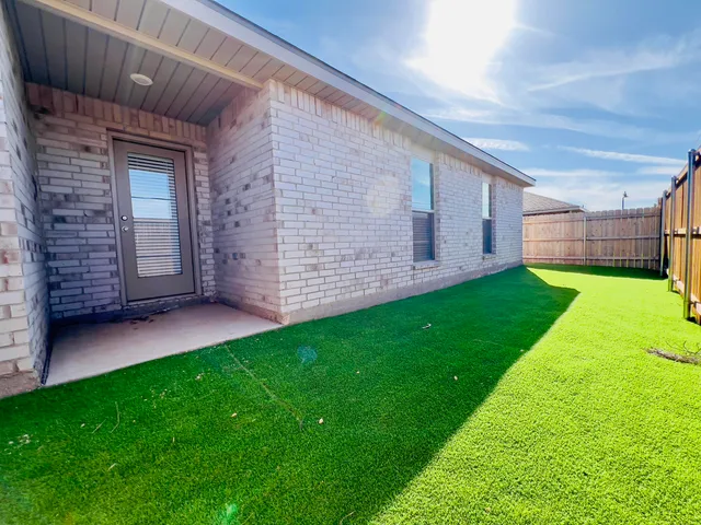 a view of a backyard with a garden