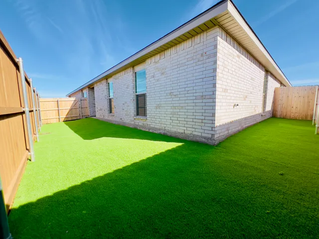 a view of a backyard with a garden