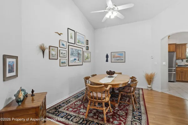 a view of a dining room with furniture window and wooden floor