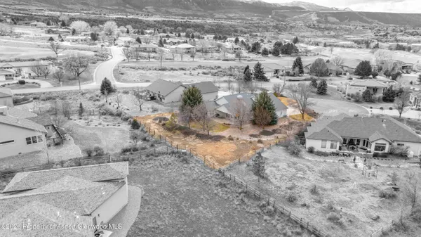 an aerial view of residential house with parking space