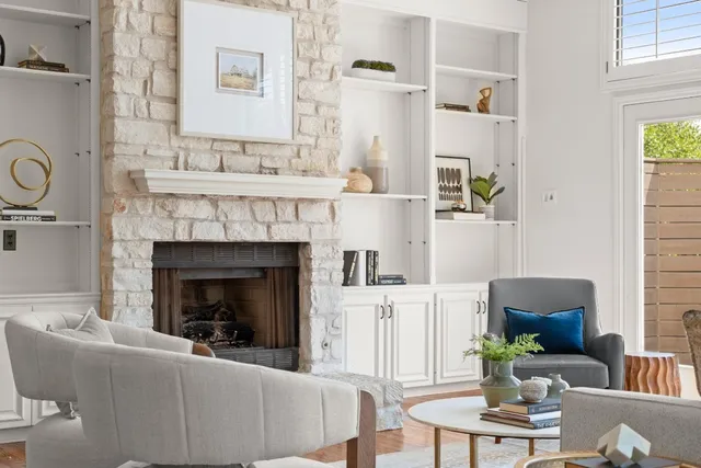 a living room with furniture and a fireplace