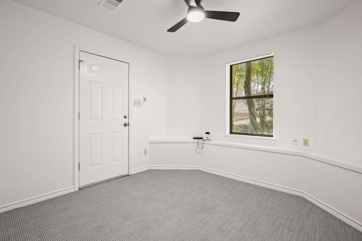 4906 Bob Cat Run Austin, TX 78731 - Photo 28 of 37 Carpeted empty room with baseboards and ceiling fan