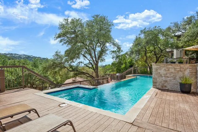 a view of a backyard with sitting area