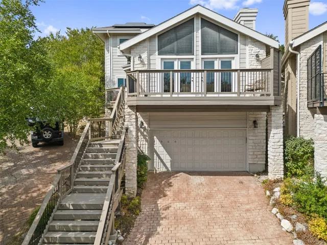 a front view of a house with stairs