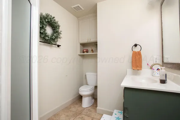 a bathroom with a sink and a toilet