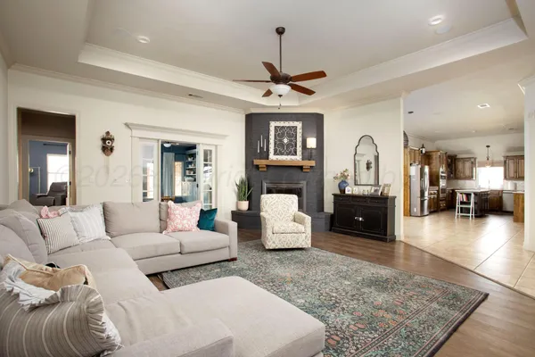 a living room with furniture and a fireplace
