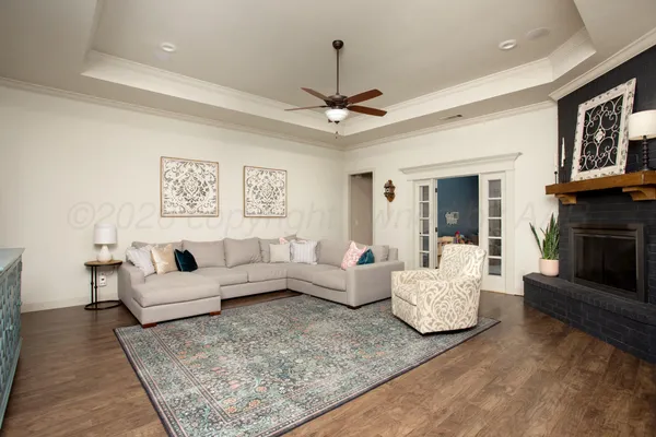 a living room with furniture and a fireplace
