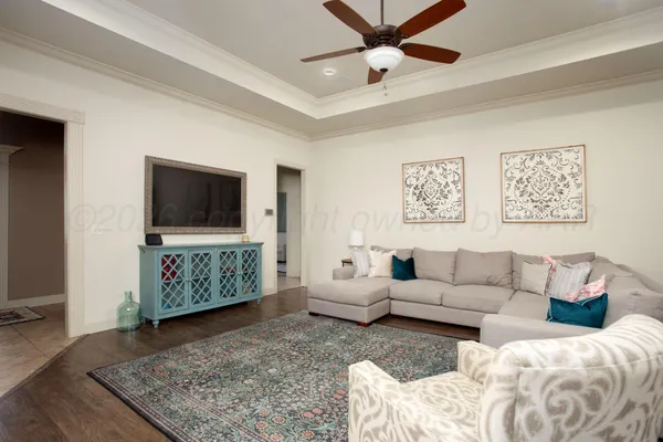 a living room with furniture and a flat screen tv