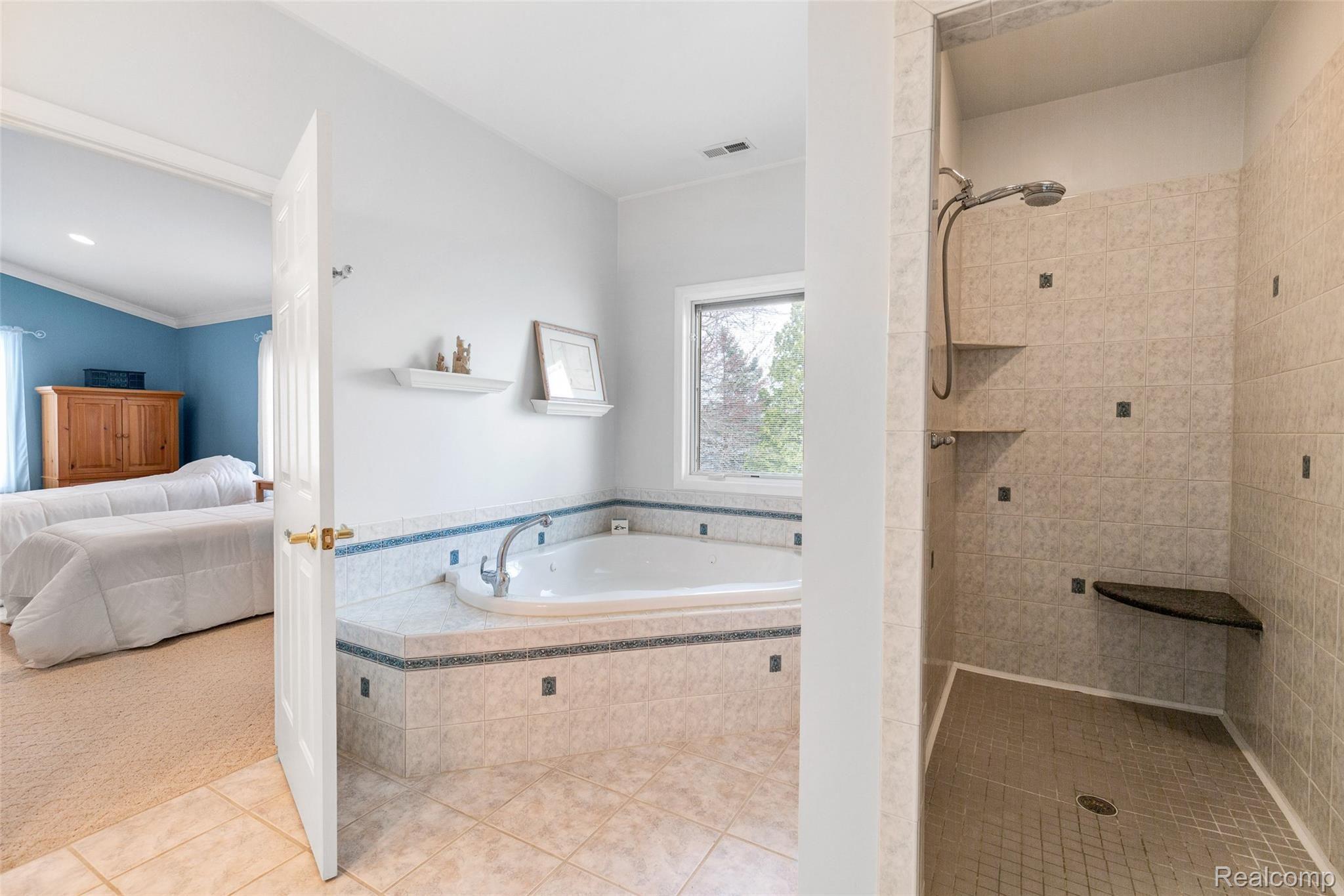 7784 Tipsico Lake Road Holly, MI 48442 - Photo 31 of 55 Owner's bath and large shower