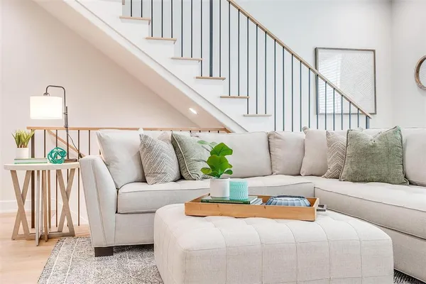 a living room with furniture and a rug