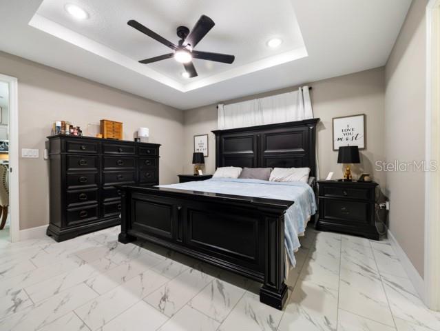 156 Juniper Circle Ocala, FL 34480 - Photo 11 of 40 a bed room with a bed and a television