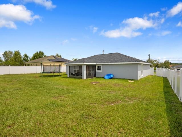 156 Juniper Circle Ocala, FL 34480 - Photo 23 of 40 a front view of a house with a garden