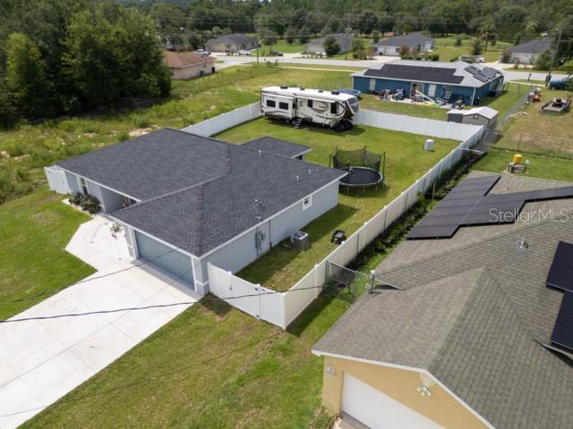156 Juniper Circle Ocala, FL 34480 - Photo 36 of 40 an aerial view of a house with a garden and swimming pool