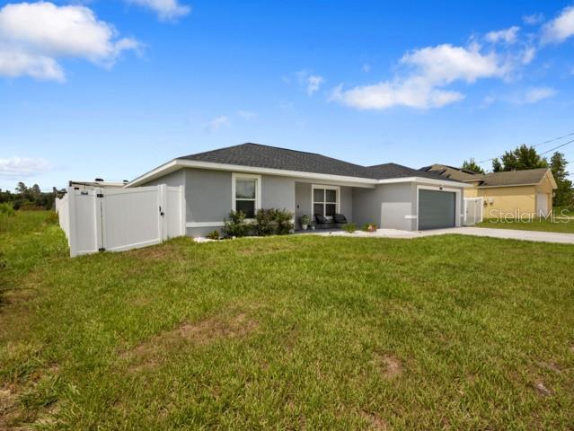 156 Juniper Circle Ocala, FL 34480 - Photo 37 of 40 a front view of a house with a garden