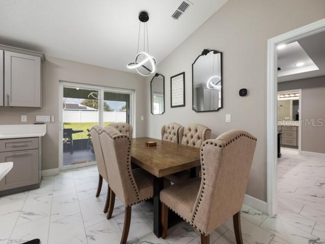 156 Juniper Circle Ocala, FL 34480 - Photo 10 of 40 a view of a dining room with furniture