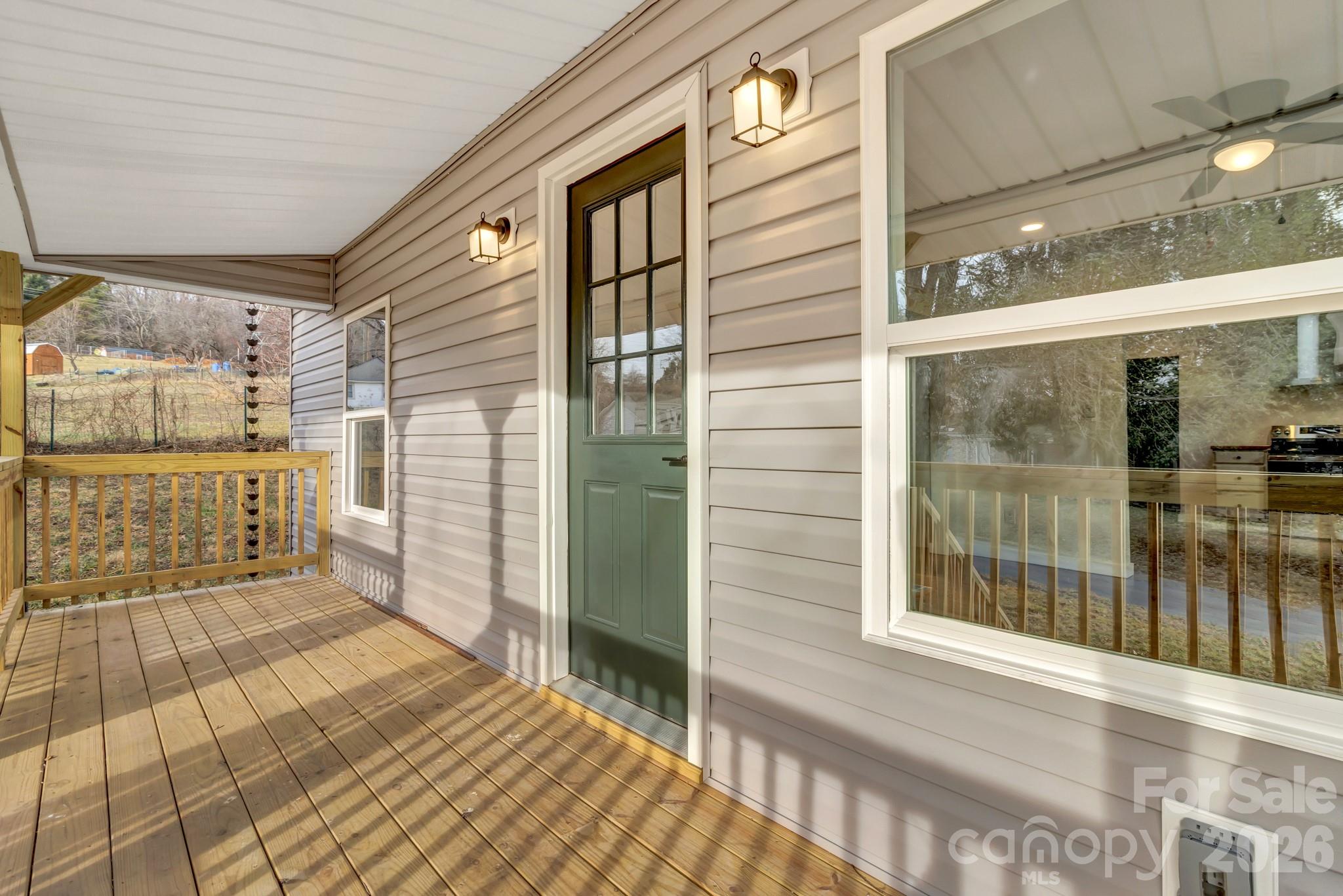 246 Marion Street Marion, NC 28752 - Photo 11 of 48 a view of a balcony with door