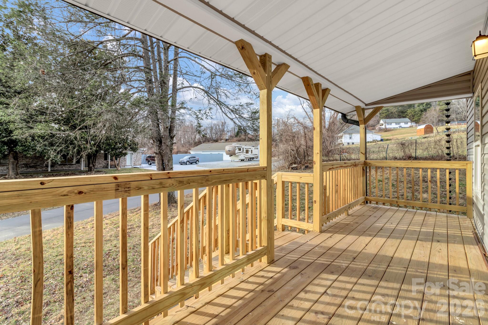 246 Marion Street Marion, NC 28752 - Photo 13 of 48 a view of a balcony with wooden floor