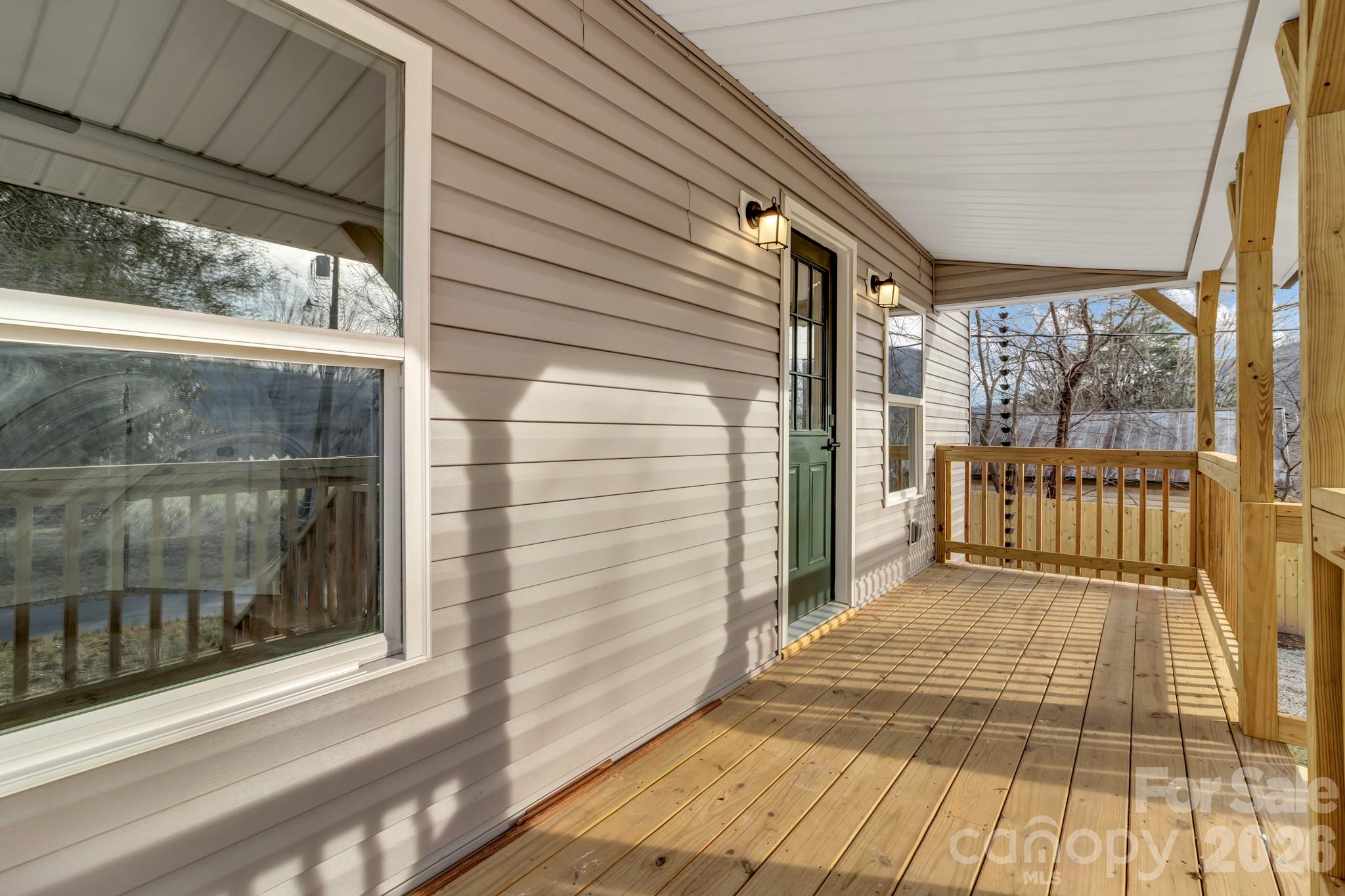 246 Marion Street Marion, NC 28752 - Photo 14 of 48 a view of a balcony with wooden floor