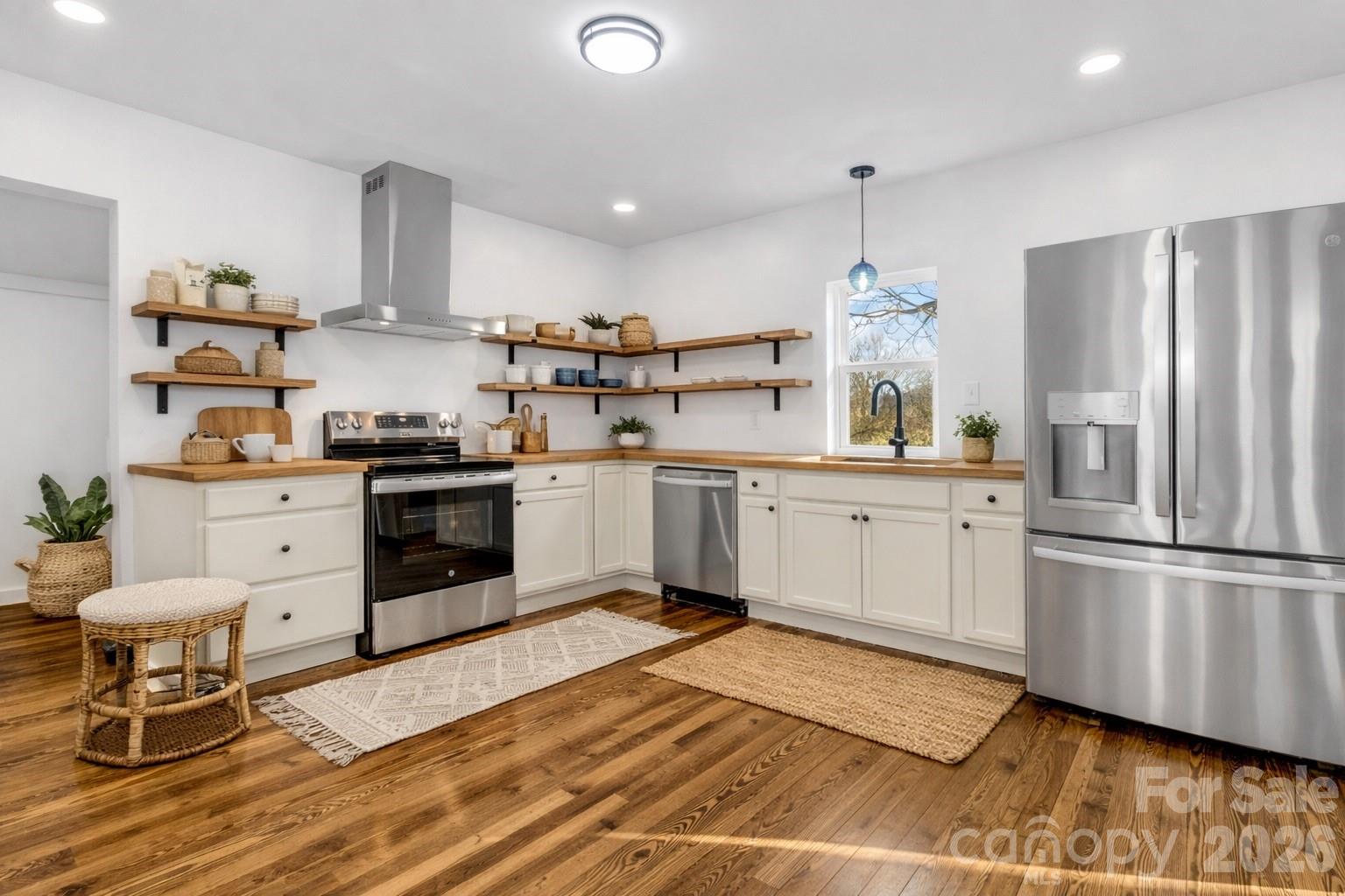 246 Marion Street Marion, NC 28752 - Photo 2 of 48 a kitchen with a sink appliances and cabinets