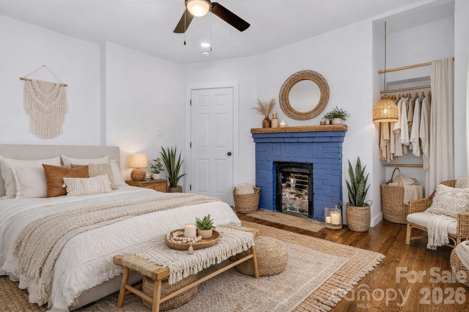 246 Marion Street Marion, NC 28752 - Photo 3 of 48 a bedroom with a bed and a fireplace