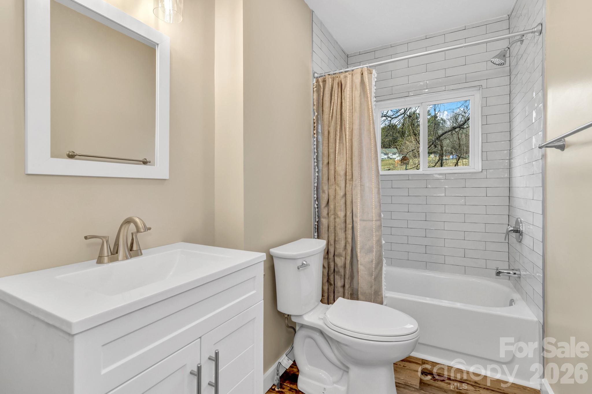 246 Marion Street Marion, NC 28752 - Photo 40 of 48 a bathroom with a sink toilet and shower