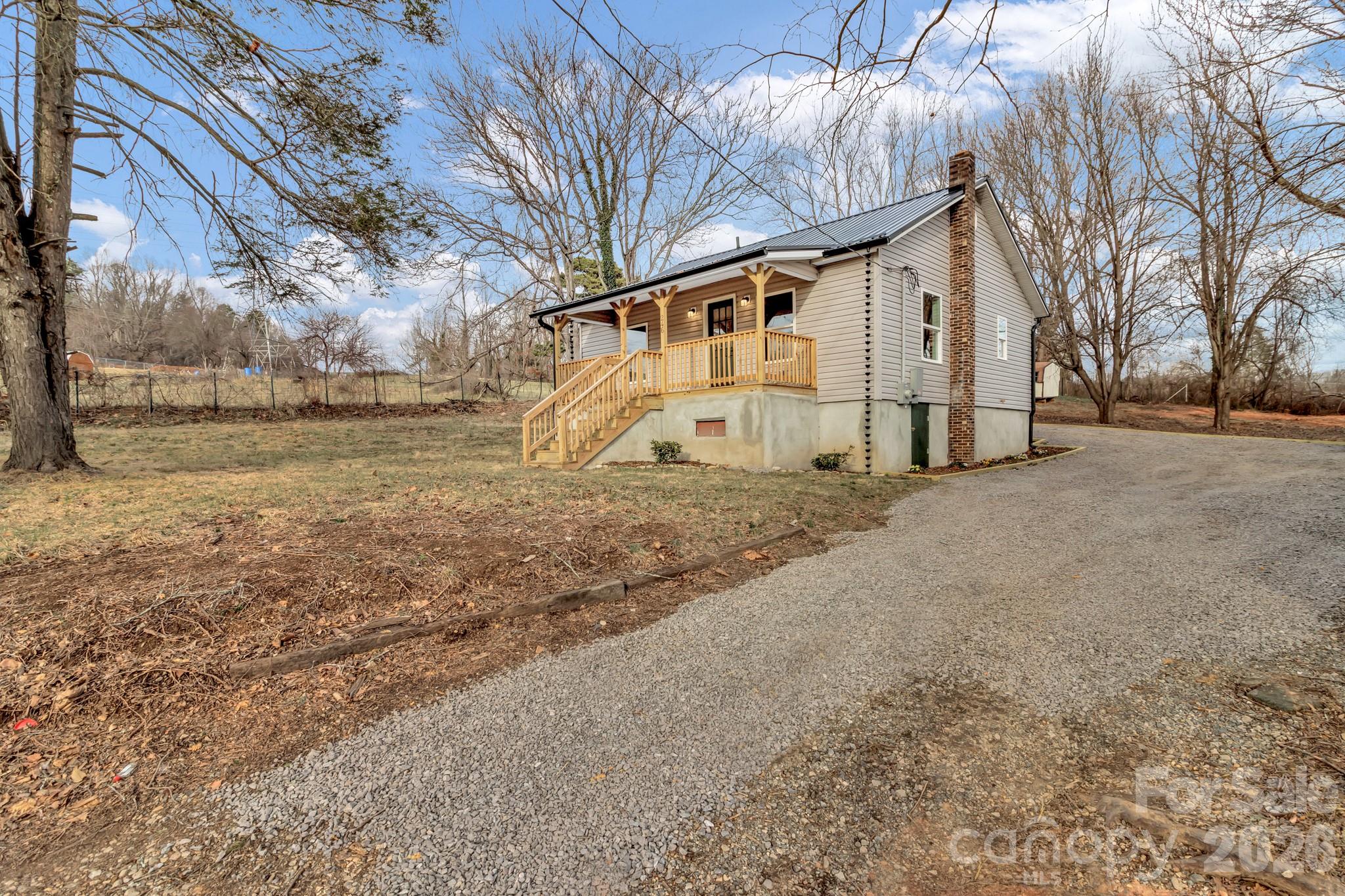 246 Marion Street Marion, NC 28752 - Photo 4 of 48 a view of a house with a yard
