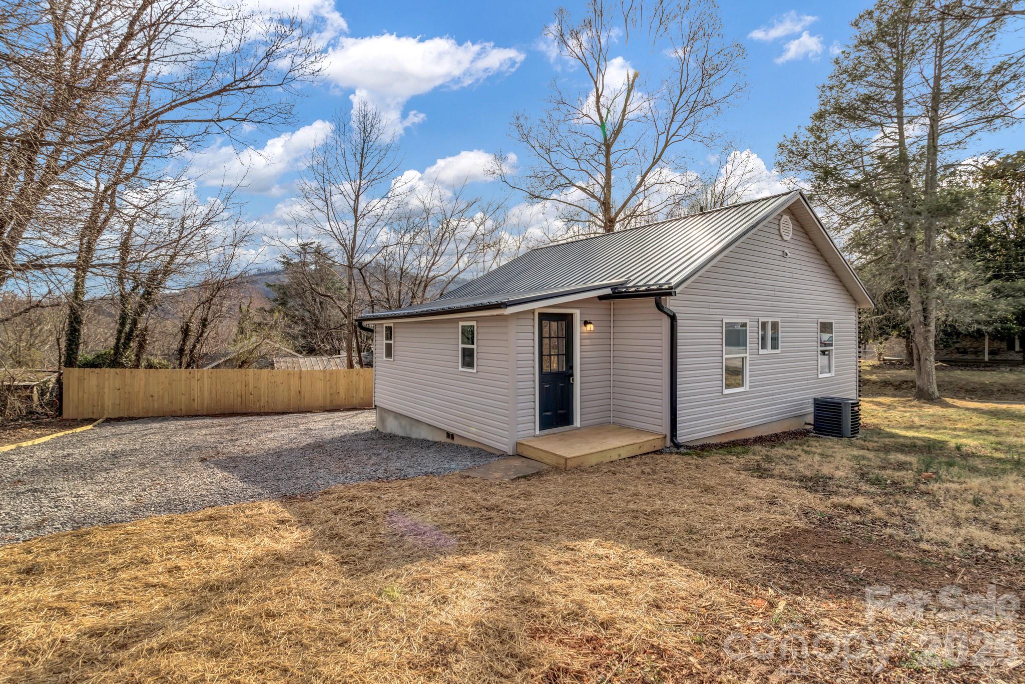 246 Marion Street Marion, NC 28752 - Photo 46 of 48 a view of a house with a yard covered in snow
