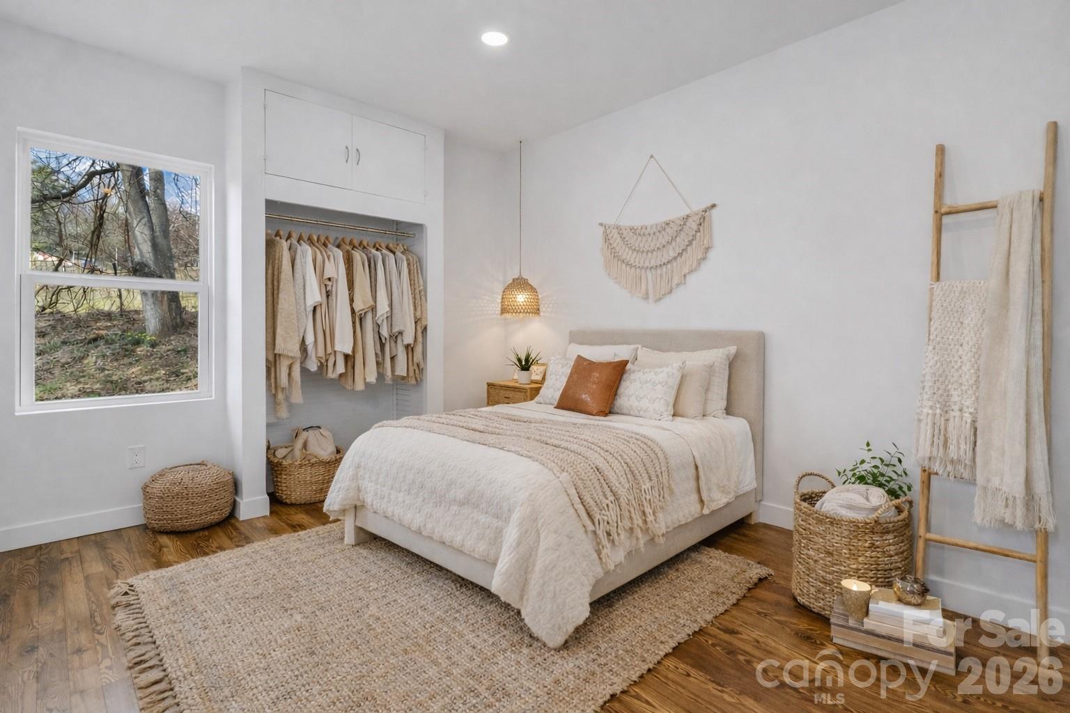 246 Marion Street Marion, NC 28752 - Photo 6 of 48 a bedroom with a bed and window