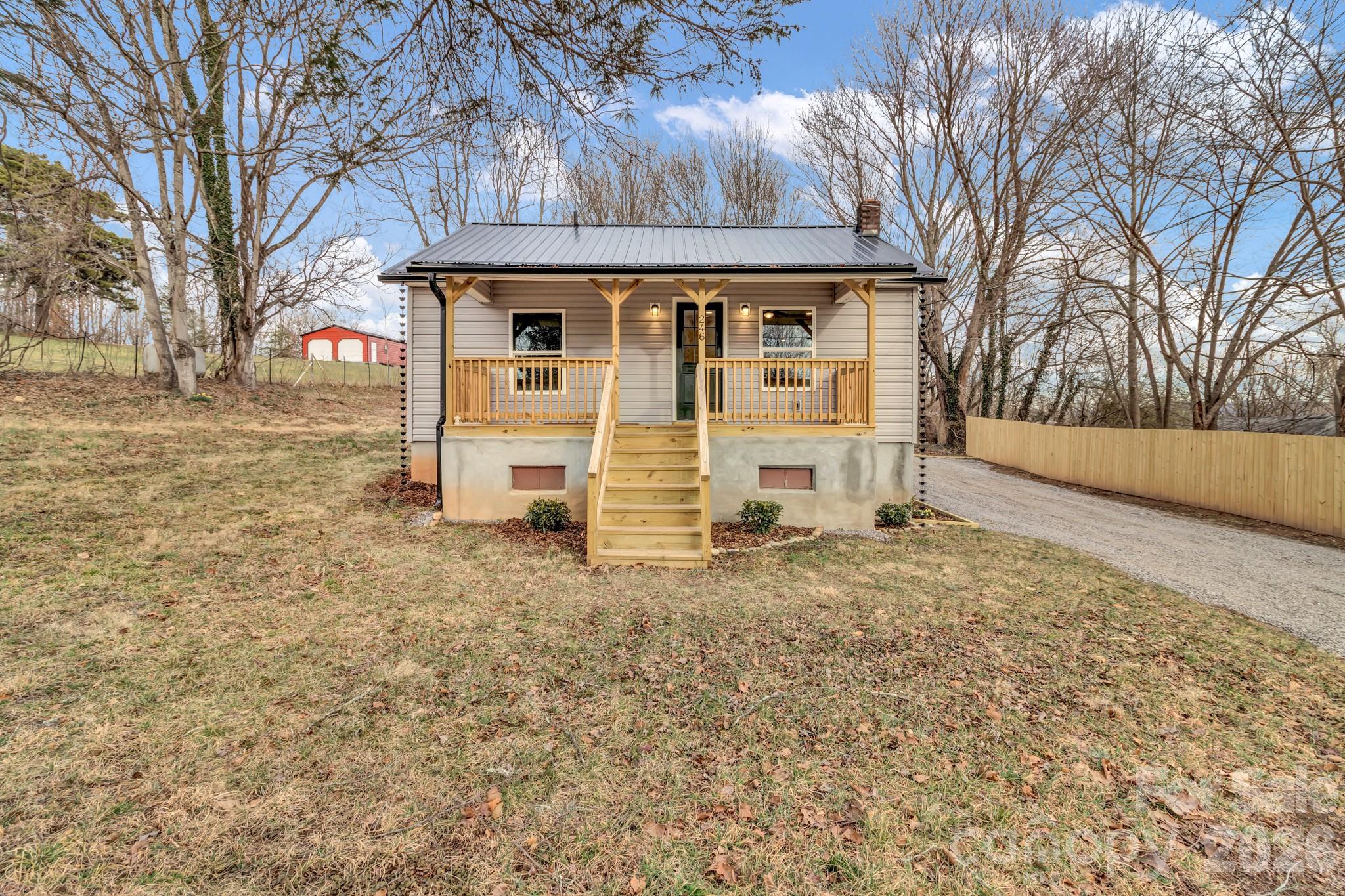246 Marion Street Marion, NC 28752 - Photo 10 of 48 a front view of a house with a yard