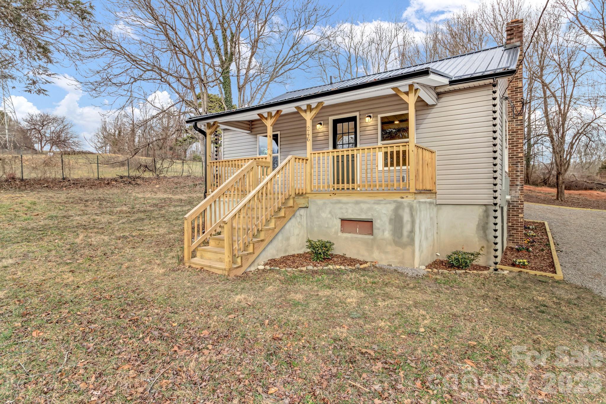 246 Marion Street Marion, NC 28752 - Photo 10 of 48 a view of a house with a yard