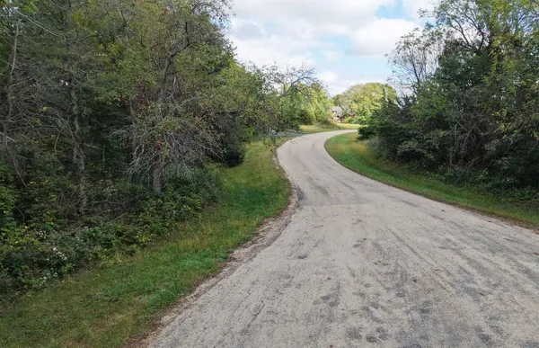 an aerial view of a forest with houses