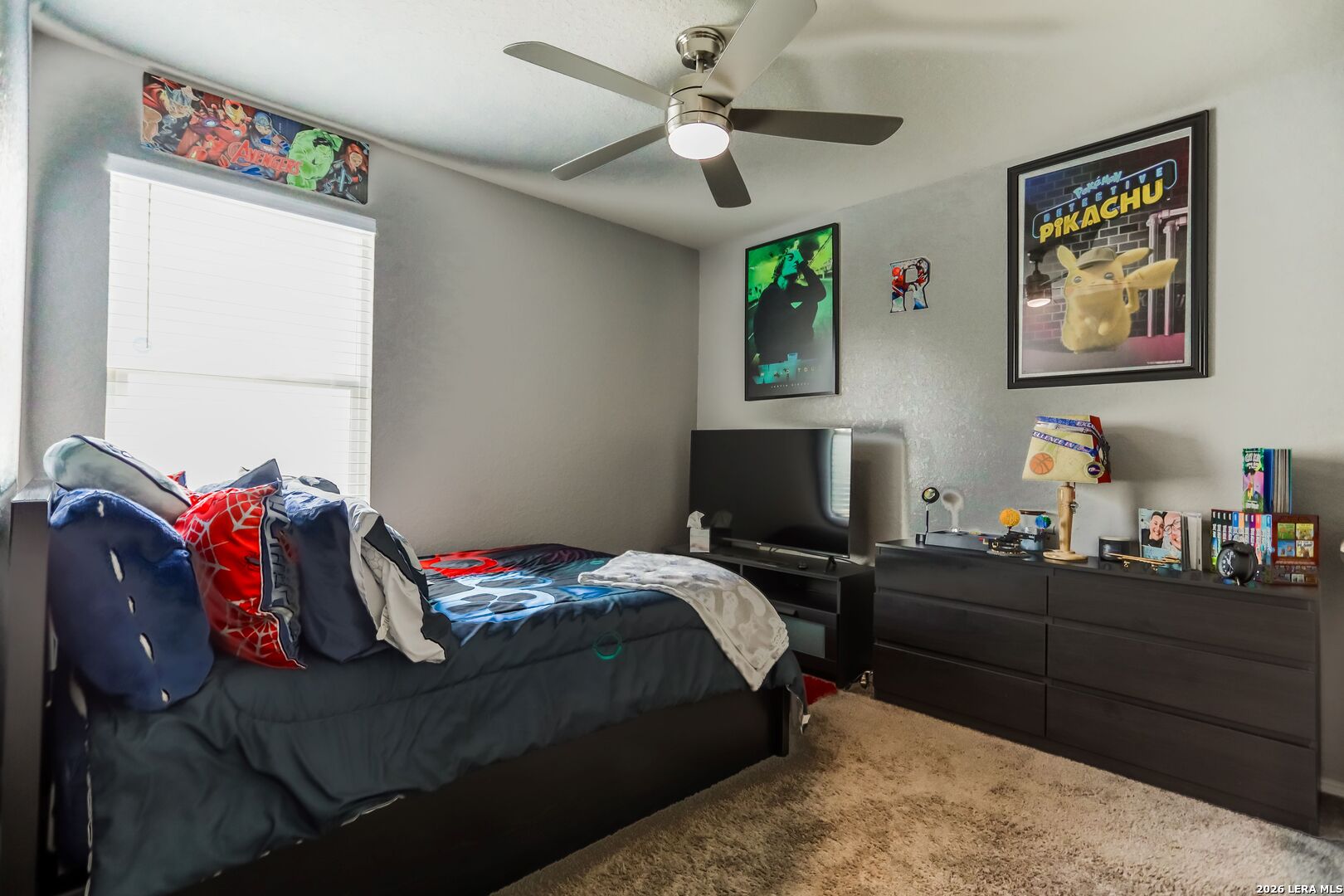 3318 Carducci Drive Converse, TX 78109 - Photo 11 of 14 a bedroom with a bed and a desk