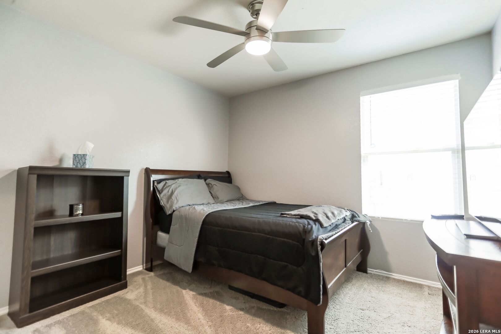 3318 Carducci Drive Converse, TX 78109 - Photo 12 of 14 a bedroom with a bed and a window