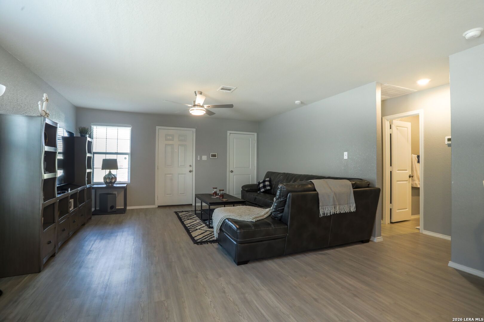 3318 Carducci Drive Converse, TX 78109 - Photo 3 of 14 a living room with furniture and a flat screen tv