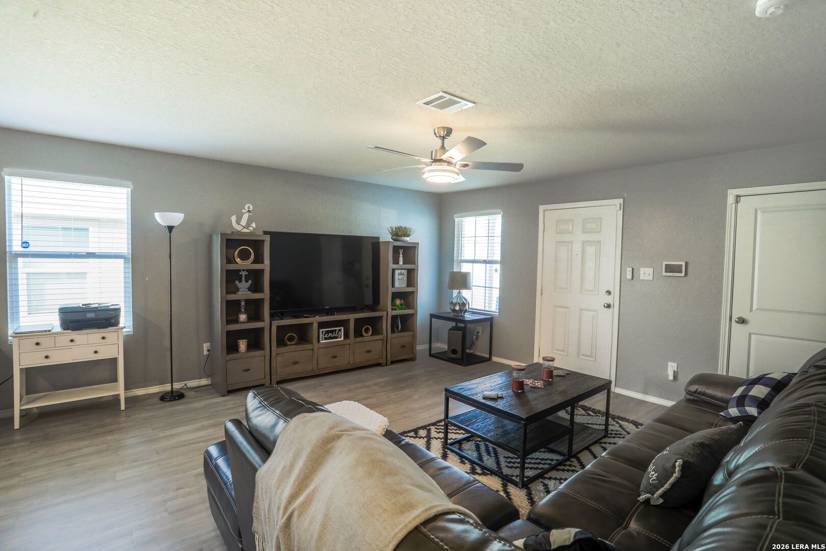 3318 Carducci Drive Converse, TX 78109 - Photo 4 of 14 a living room with furniture and a flat screen tv