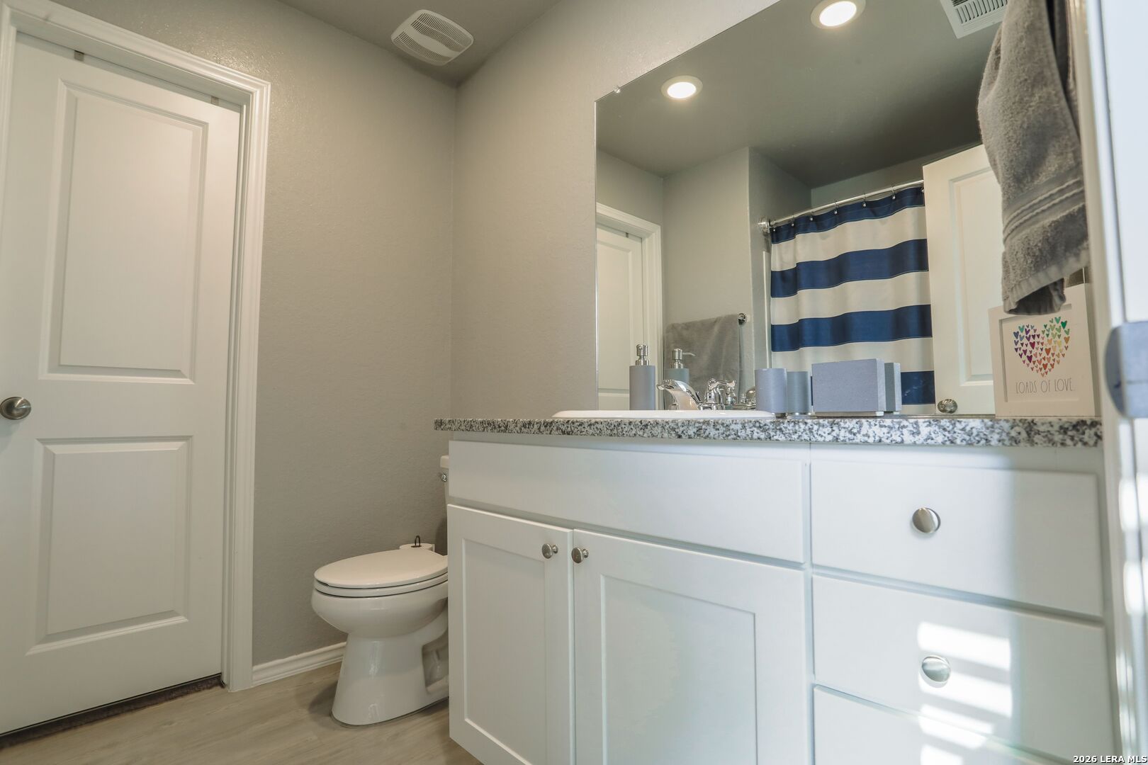 3318 Carducci Drive Converse, TX 78109 - Photo 10 of 14 a bathroom with a sink toilet and shower