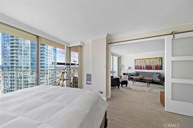 a spacious bathroom with a granite countertop sink a mirror and a shower