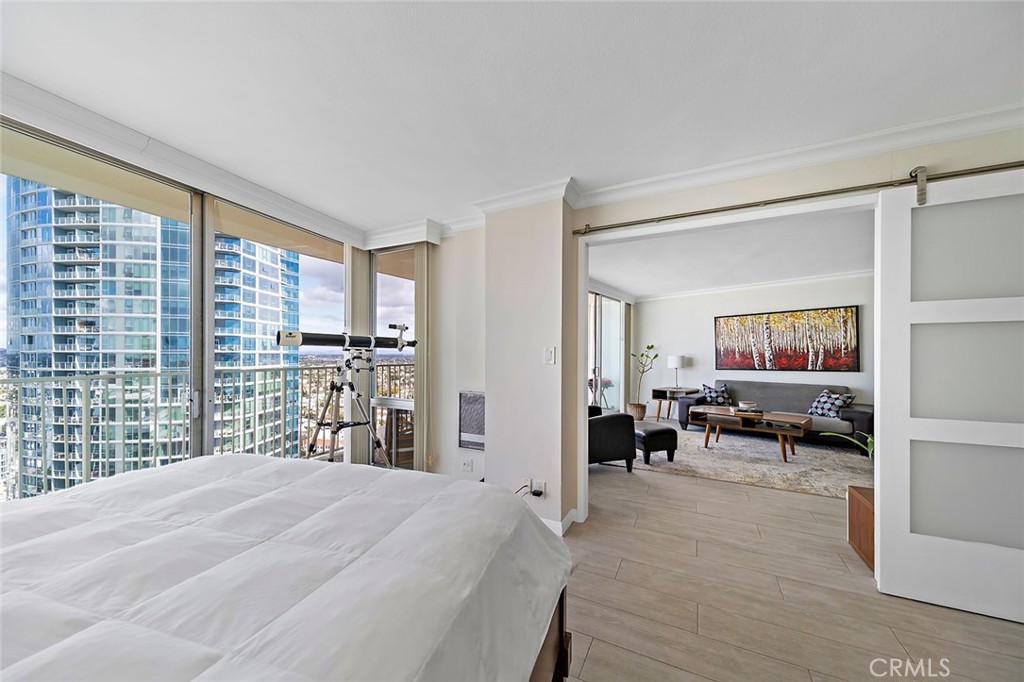 700 East Ocean Boulevard, Unit 3003 Long Beach, CA 90802 - Photo 16 of 39 a bedroom with furniture and a large window