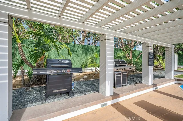 a living room with furniture and a ceiling fan