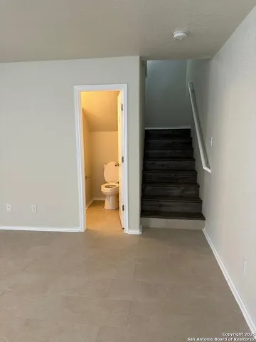 a view of a room with a staircase