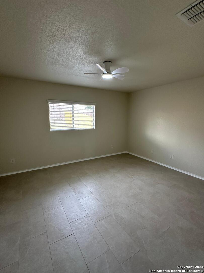 25346 Colt River San Antonio, TX 78261 - Photo 17 of 35 an empty room with a empty space and windows