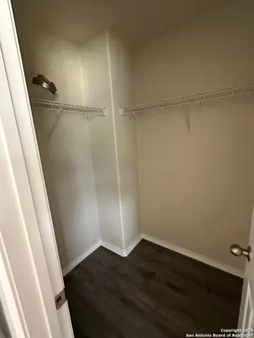 a view of an empty walk in closet