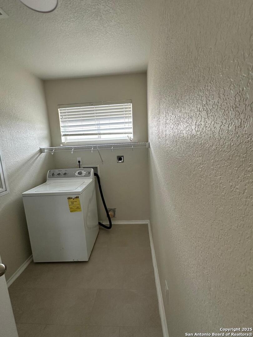 25346 Colt River San Antonio, TX 78261 - Photo 27 of 35 a room with a washer and dryer