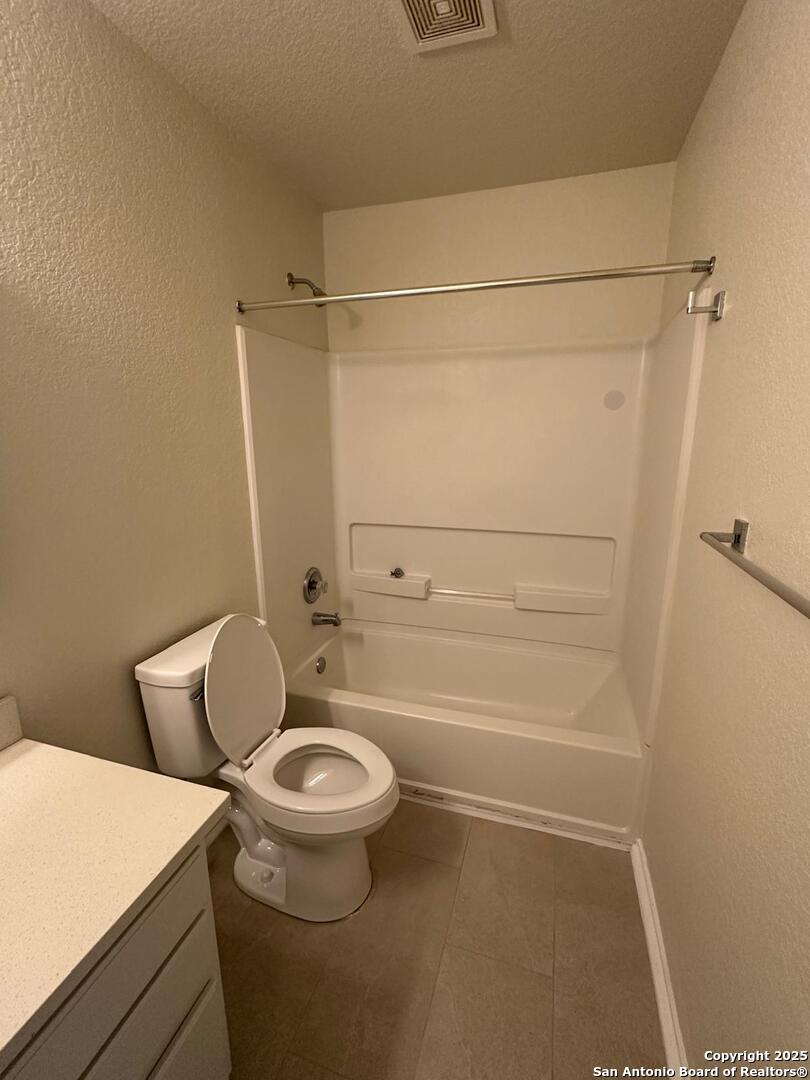 25346 Colt River San Antonio, TX 78261 - Photo 29 of 35 a bathroom with a toilet and a shower